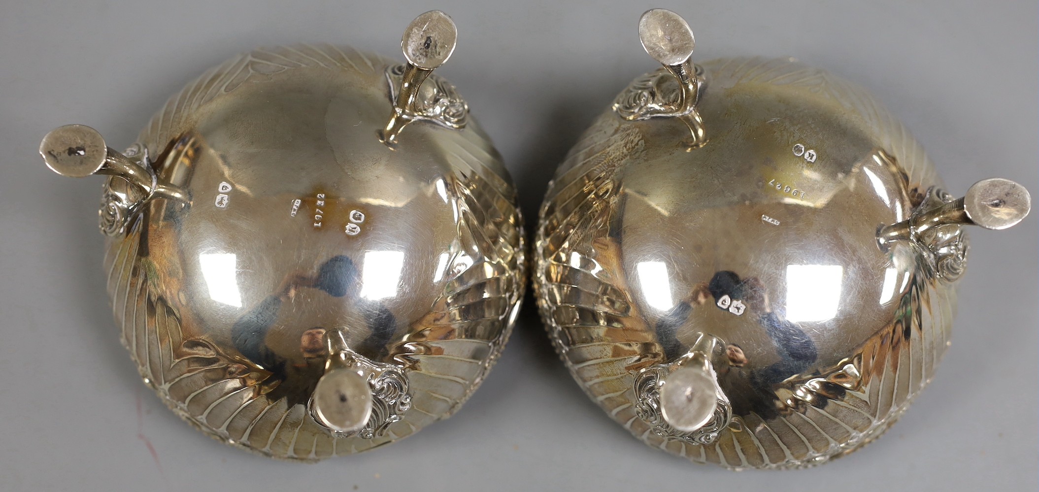 A pair of late Victorian fluted silver sweetmeat bowls, on tripod supports, Daniel & John Welby, London, 1885, diameter 10.7cm, 12.1oz.